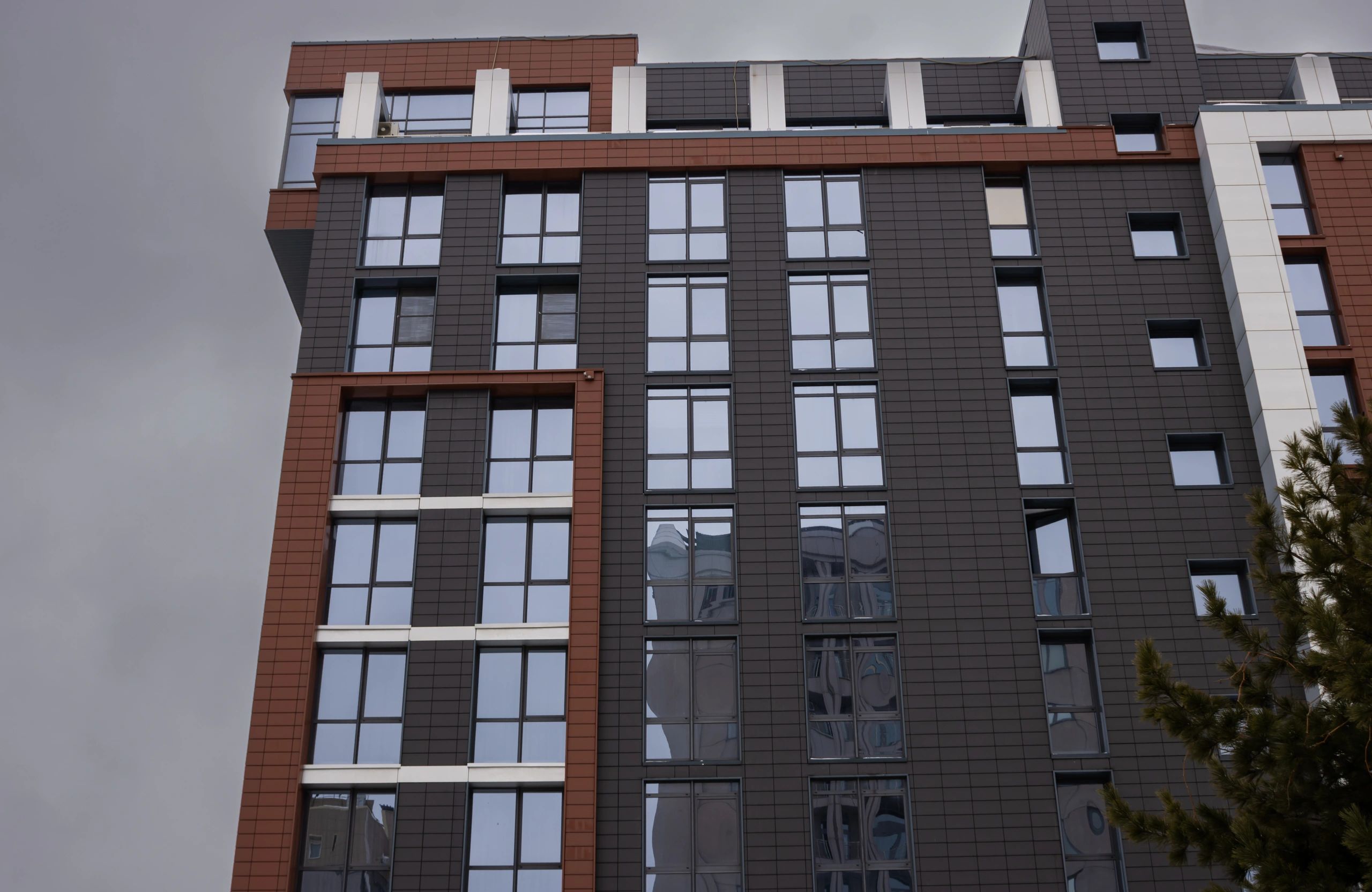Modern high-rise building facade representing property and real estate